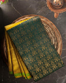 Valiba Kanchipuram silk saree has brocade of gold zari flower pots With edge and rich brocade Saree
