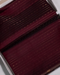 Yamika – Maroon Katan Silk Saree with Gold Zari Stripes and Leaf Motifs