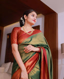 Beautiful Green And Red With Gold Weaving Work Banarasi Lichi Silk .