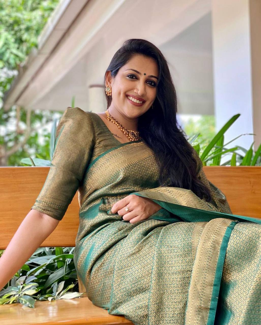 Mitera Green Woven Designer Party Wear Soft Silk  Lichi Silk Saree .