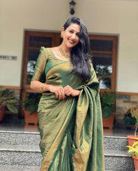 Mitera Green Woven Designer Party Wear Soft Silk  Lichi Silk Saree .